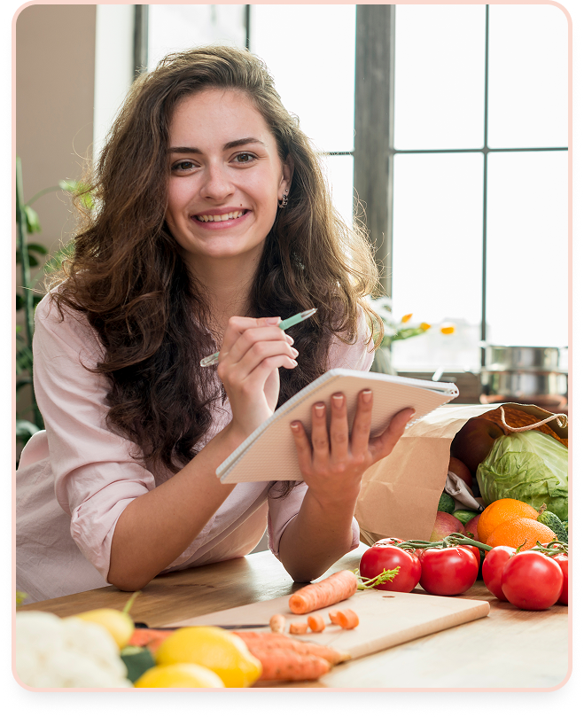 Woman enjoying a healthy salad in a bright kitchen